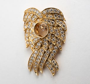 14K YELLOW GOLD 'DANCING DIAMOND' PENDANT.