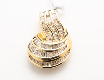 14 KARAT CHANNEL SET DIAMOND BAGUETTE PENDANT.