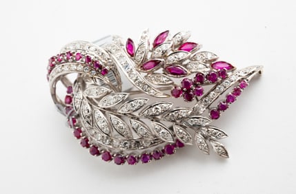 18K WHITE GOLD, DIAMOND AND RUBY FEATHER BROOCH.
