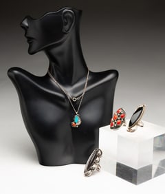 THREE NATIVE AMERICAN STERLING SILVER RINGS AND A PENDANT NECKLACE.