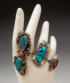 THREE NAVAJO STERLING AND CORAL RINGS.
