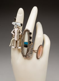 THREE NATIVE AMERICAN STERLING SILVER AND GEMSTONE RINGS.