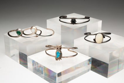 FIVE STERLING SILVER NAVAJO CUFFS.