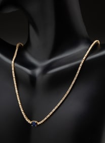 14K YELLOW GOLD DIAMOND AND SAPPHIRE TENNIS NECKLACE.