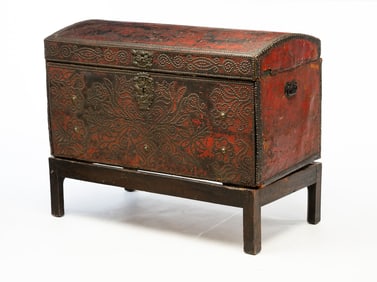 LEATHER-CLAD, BRASS-STUDDED, AND POLYCHROMED FALL-FRONT TRUNK-ON-STAND.