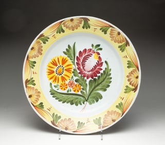 POLYCHROME TIN GLAZED FAIENCE SHALLOW BOWL.