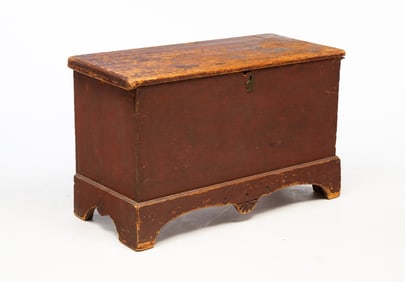 NEW ENGLAND PAINTED PINE BLANKET CHEST WITH FOLKSY CARVING.