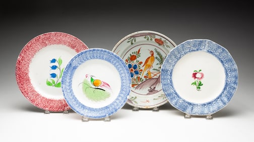 THREE SPATTERWARE AND ONE TIN GLAZE FAIENCE PLATES.