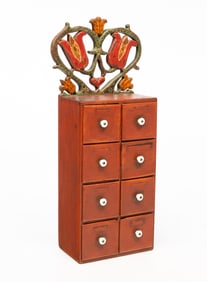 PENNSYLVANIA FOLK ART CARVED AND PAINTED PINE EIGHT-DRAWER SPICE CABINET.