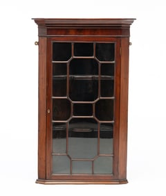 GEORGE III MAHOGANY HANGING CORNER CUPBOARD.