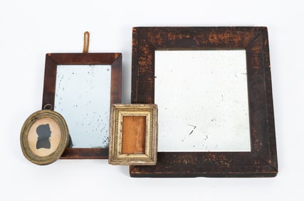 A SILHOUETTE, A DIMINUTIVE FRAME, AND TWO MIRRORS.