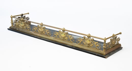 AMERICAN RENAISSANCE REVIVAL CAST AND TUBULAR BRASS FIREPLACE FENDER.