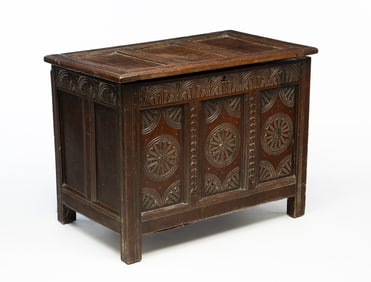 ENGLISH PANELED AND CARVED OAK COFFER.