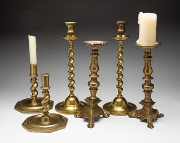 THREE PAIRS OF ENGLISH BRASS CANDLESTICKS.