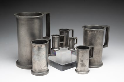 SET OF SEVEN EUROPEAN PEWTER MEASURES.