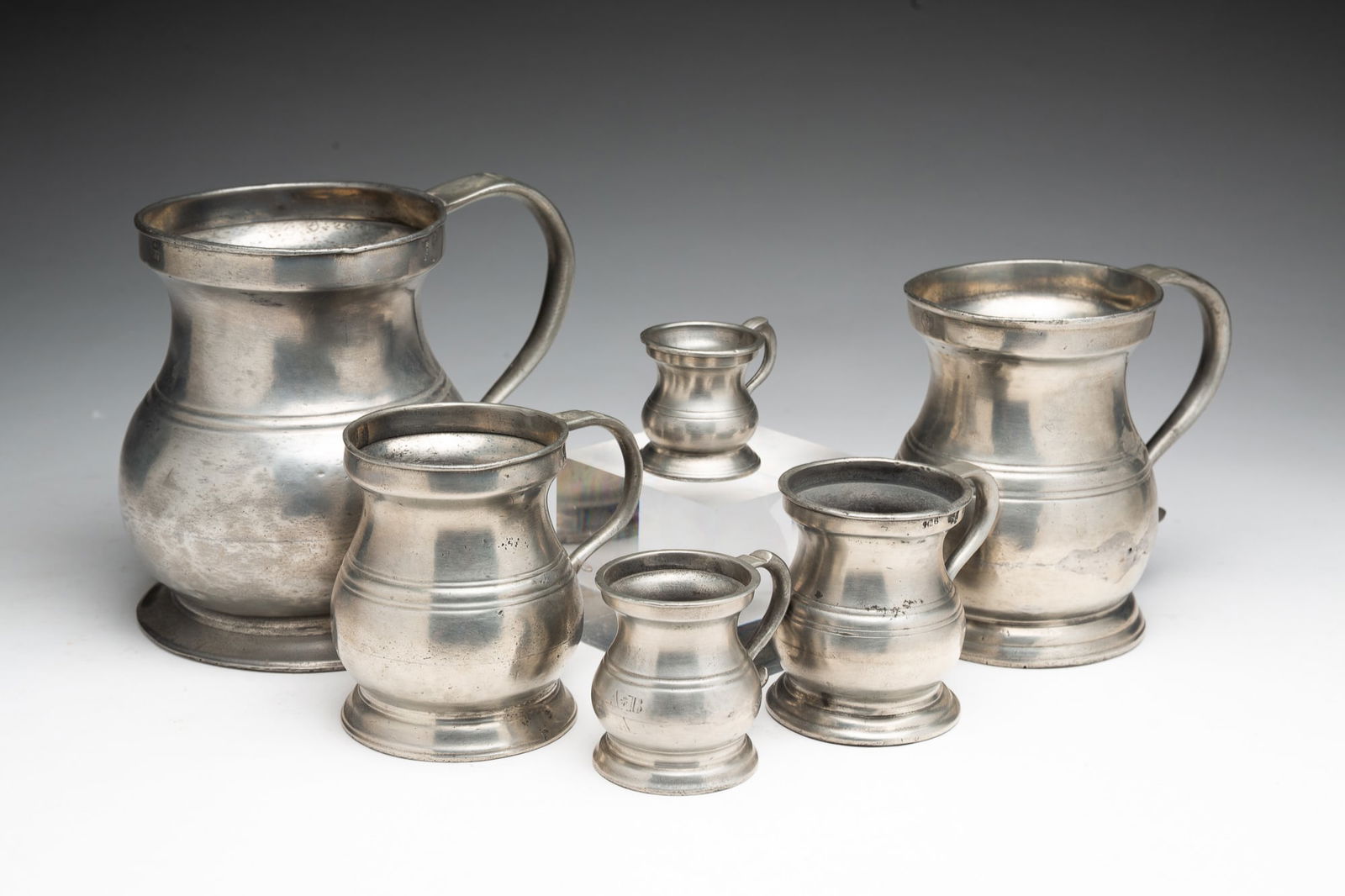 SET OF SIX ENGLISH PEWTER BELLIED MEASURES. (1 of 5)