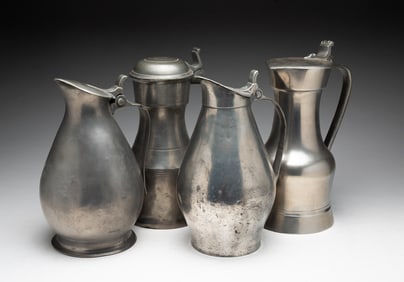 FOUR EUROPEAN PEWTER FLAGONS.