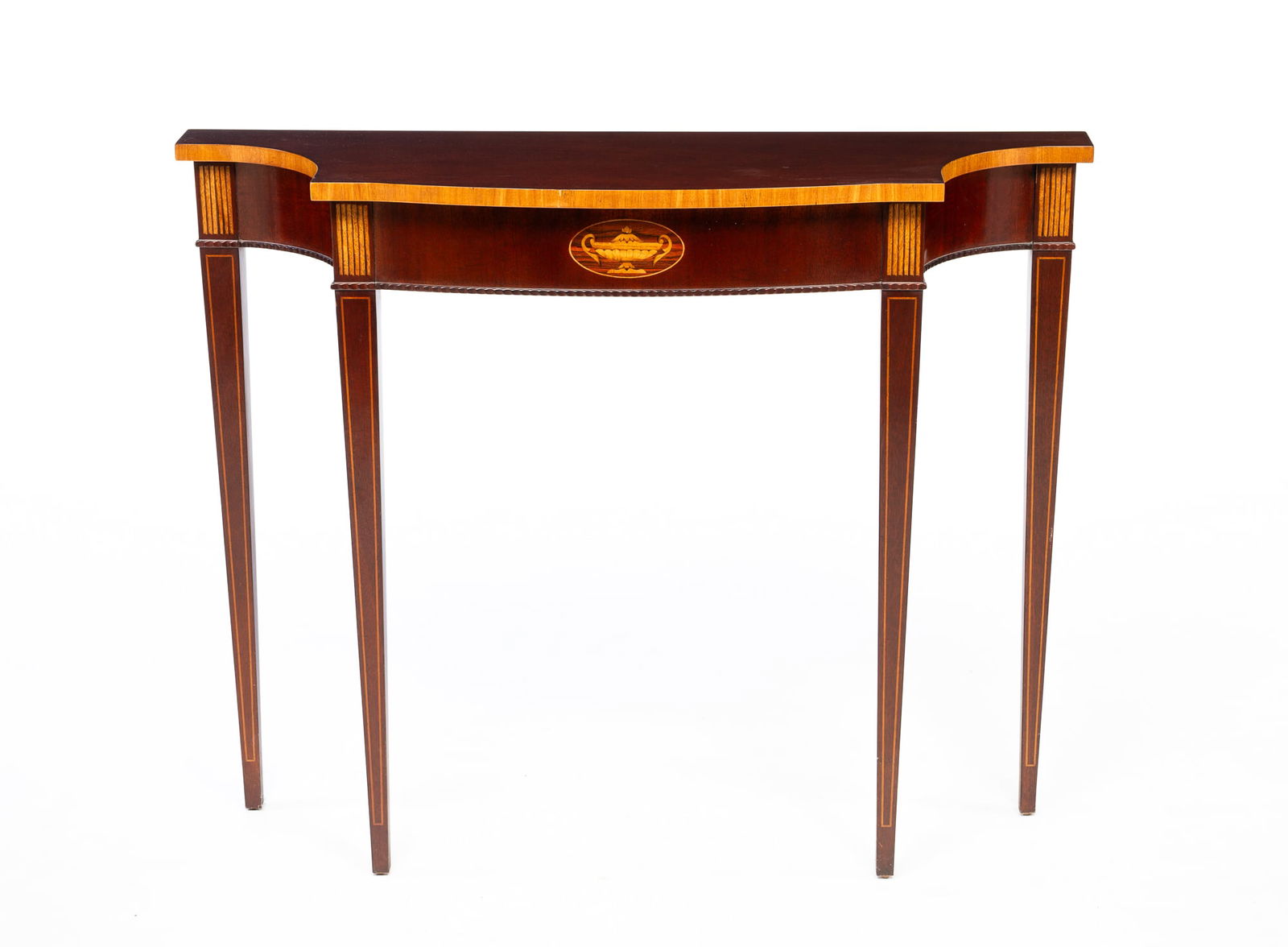 COUNCILL FURNITURE FEDERAL STYLE MAHOGANY AND MARQUETRY CONSOLE TABLE.: American, 20th Century. Mahogany. Top with slightly rounded front, concave corners, banded inlay edge, apron with inlaid urn in ellipse, sawtooth beaded edge and slender tapered legs with inlaid panel