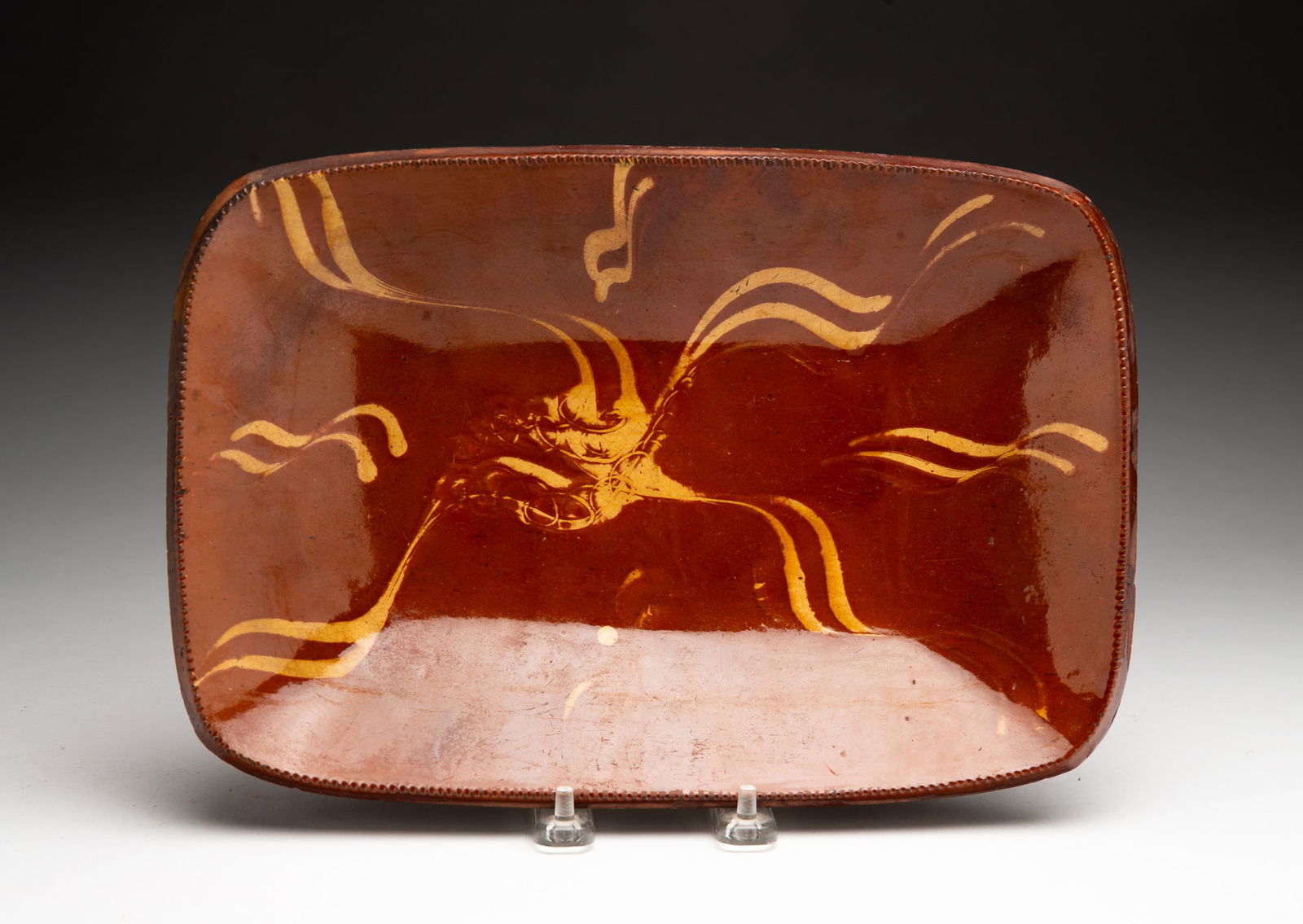 AMERICAN SLIP-DECORATED REDWARE LOAF PAN. (1 of 2)