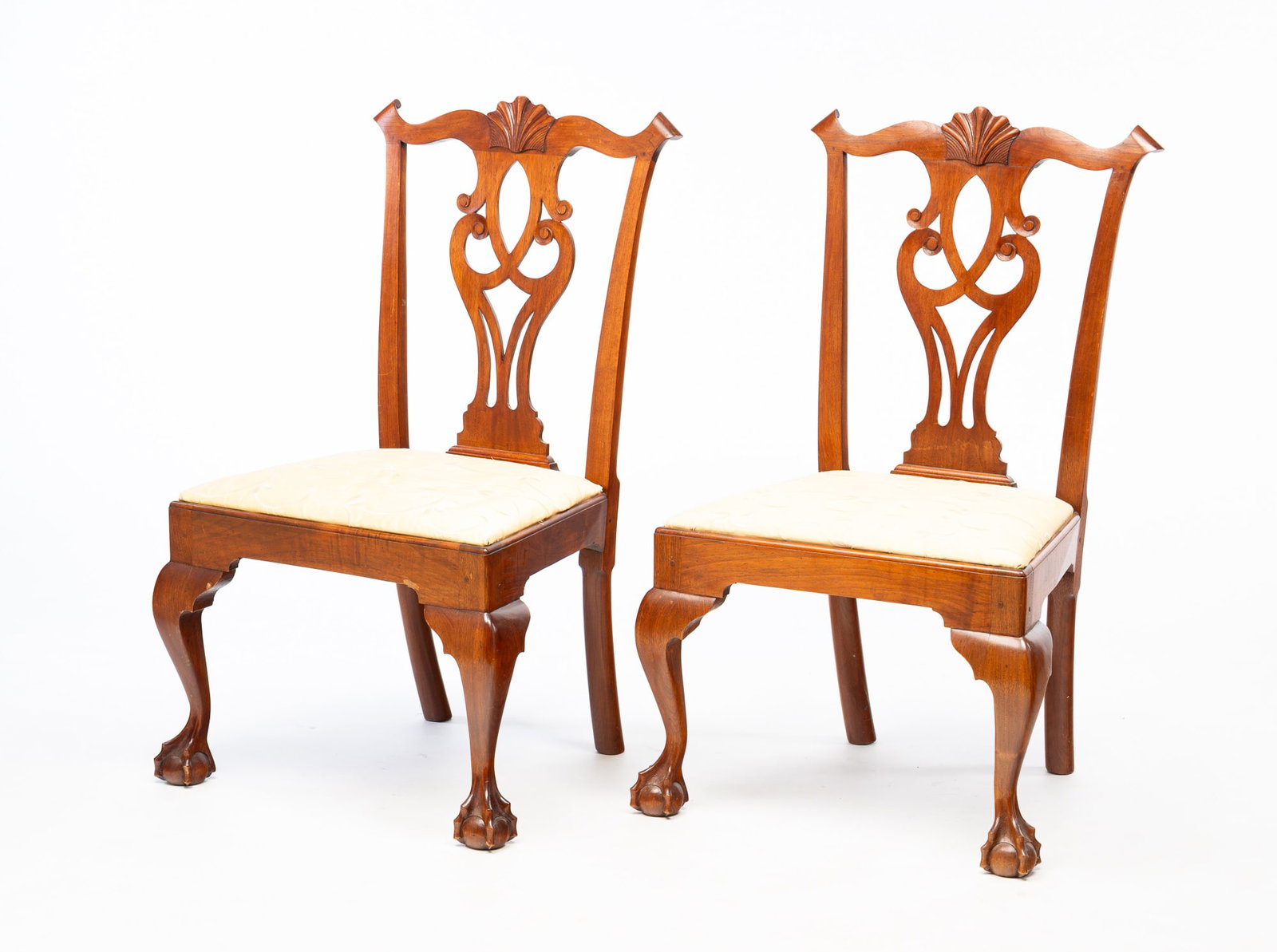 PAIR OF LAWRENCE W. CROSSAN (LYNDELL, PENNSYLVANIA) CHIPPENDALE STYLE MAHOGANY BENCH-MADE SIDE: Lawrence W. Crossan (Lyndell, Pennsylvania), Late 20th Century. Mahogany. Lobed crest with central shell carving, pierced and carved vase shape splat, trapezoidal seat, cabriole legs, ball and claw fe