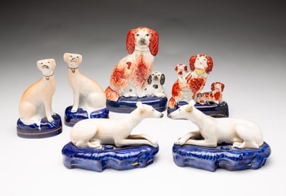 SIX STAFFORDSHIRE DOG FIGURINES.