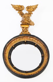 FEDERAL GILTWOOD AND EBONIZED CONVEX MIRROR WITH SPREAD-WINGED EAGLE.