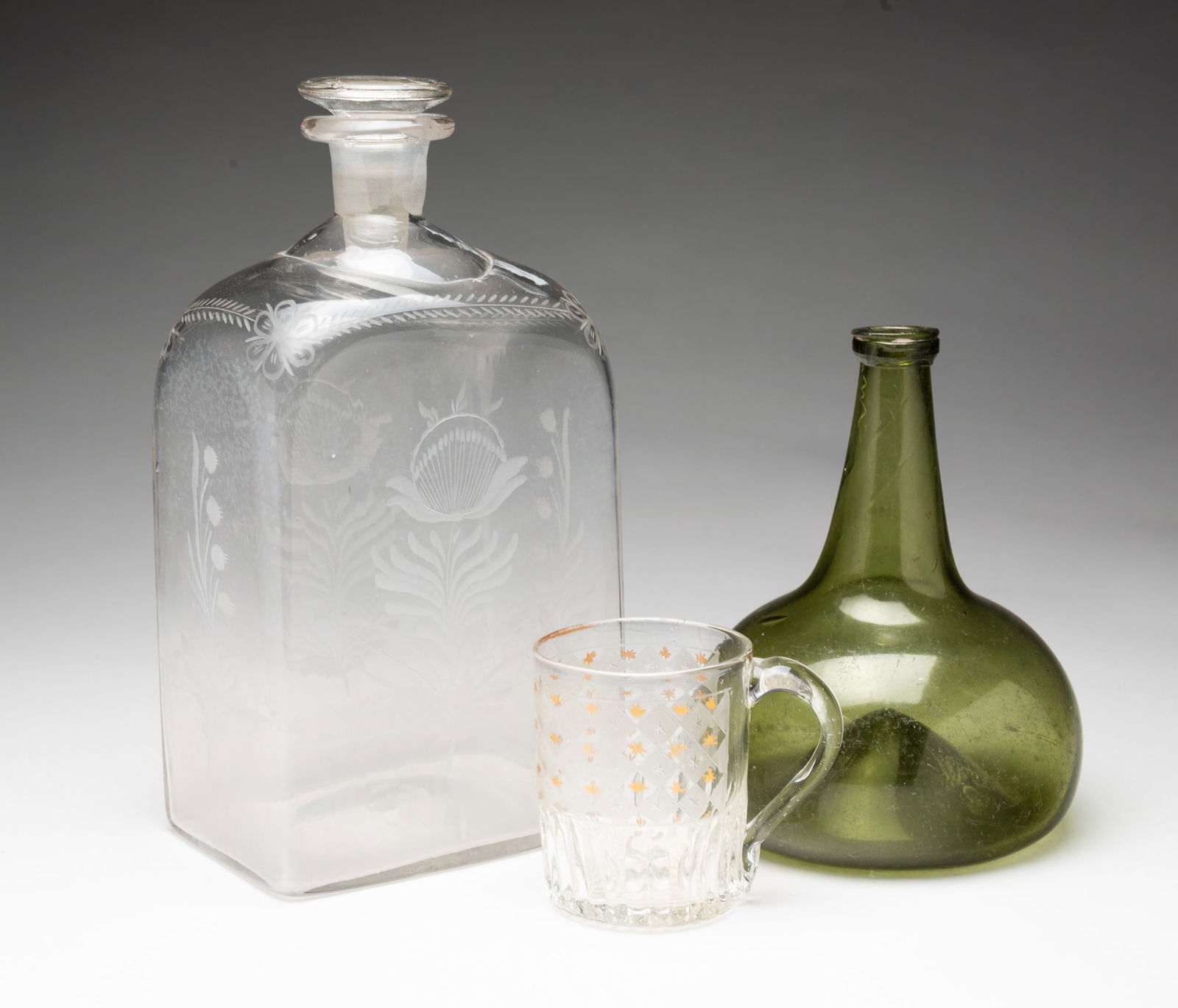 A HALF POST BOTTLE, AN ONION SHAPED BOTTLE, AND A MOLD BLOWN MUG. (1 of 5)