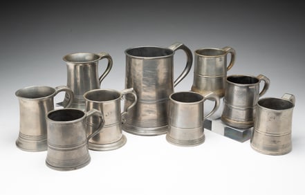 NINE EUROPEAN PEWTER STEINS.