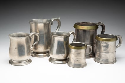 SIX ENGLISH PEWTER STEINS.
