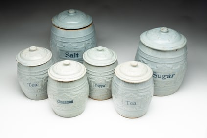 SIX AMERICAN BLUE GLAZED LIDDED STONEWARE CANISTERS.