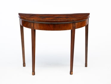 GEORGE III MAHOGANY DEMILUNE GAMES TABLE.