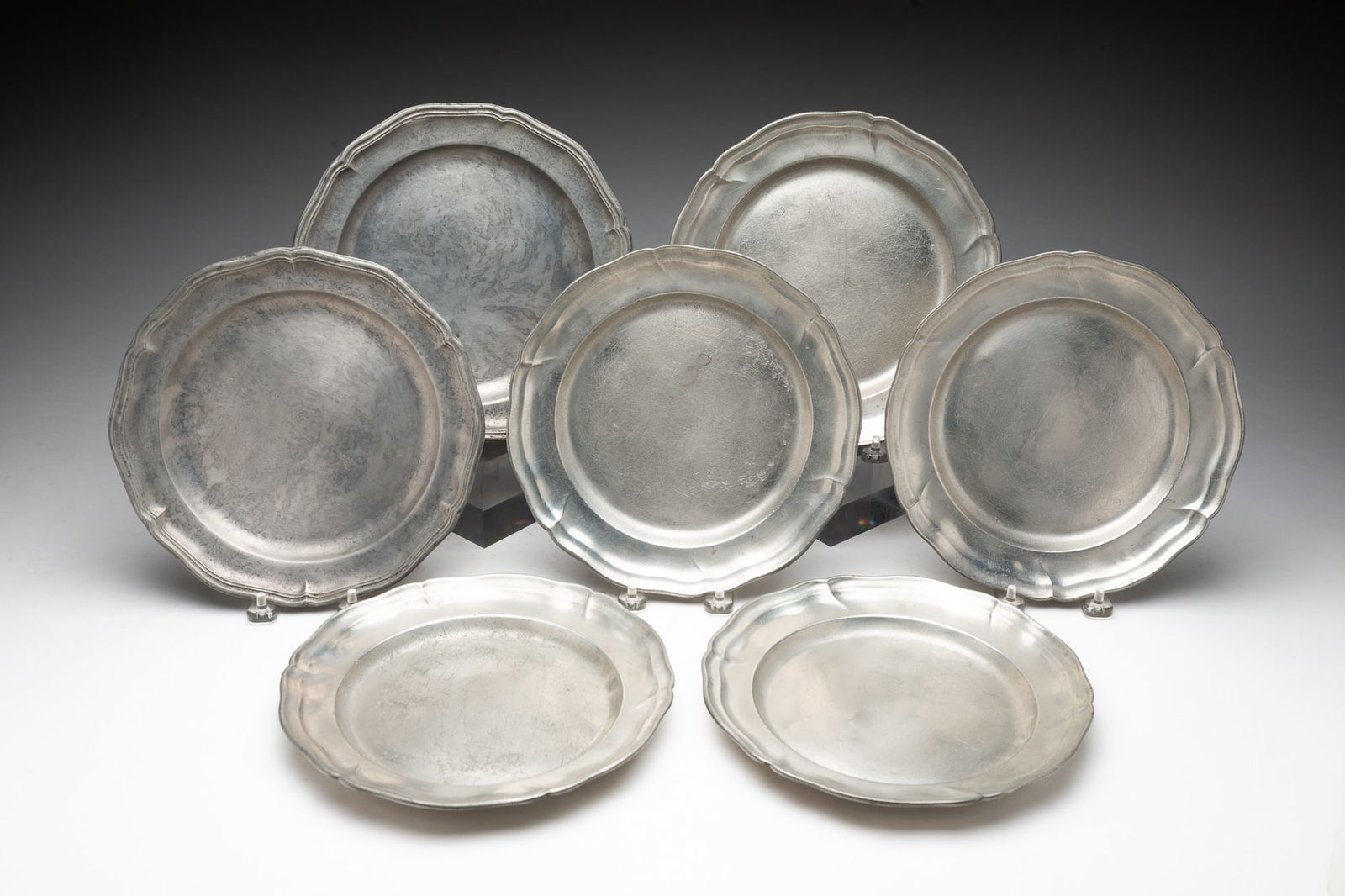 SEVEN EUROPEAN PEWTER PLATES. (1 of 3)