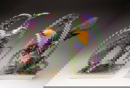 PAIR OF DOROTHY DOUGHTY FOR ROYAL WORCESTER "YELLOW HEADED BLACKBIRD" PORCELAIN FIGURES.: England, Mid-20th Century. Sculpted and painted blackbird hen and cock figures amid purple flowers, each marked and signed on underside, together with original protective wooden crates. Each approx. 1