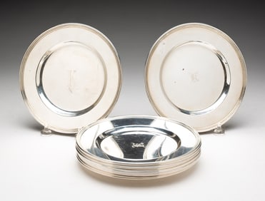 ELEVEN INTERNATIONAL STERLING SILVER MONOGRAMMED BUTTER PLATES.