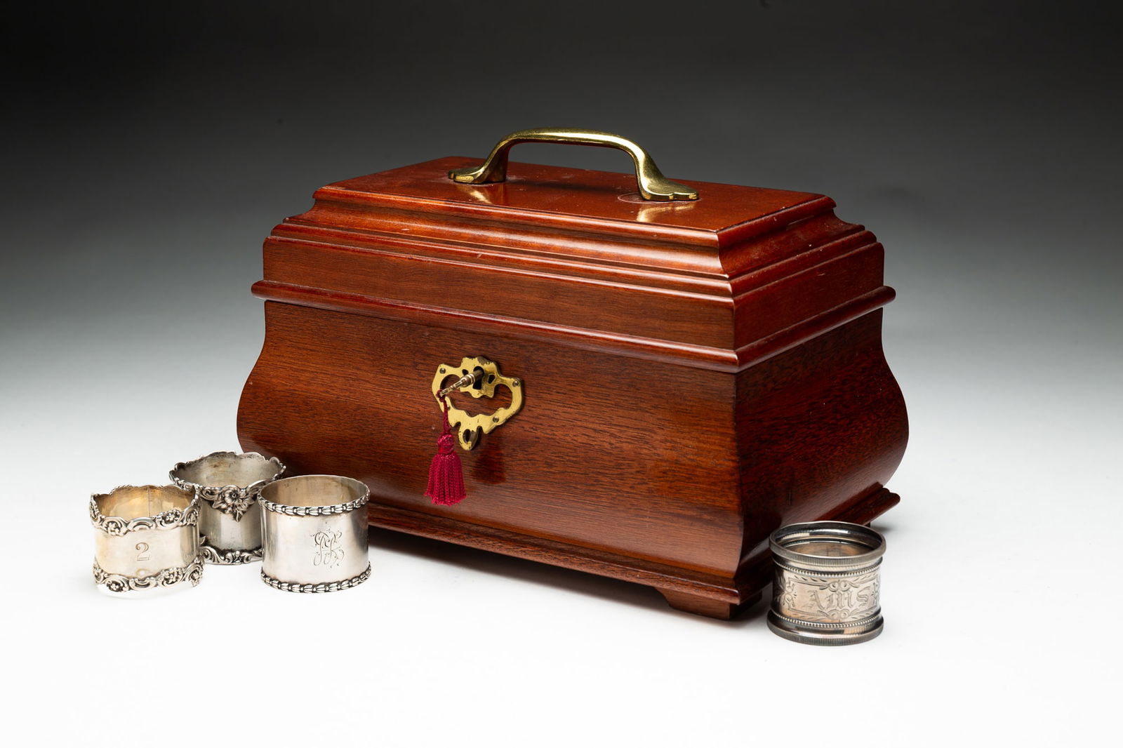 STERLING SILVER NAPKIN RINGS IN A REPRODUCTION TEA CADDY FORM BOX. (1 of 7)