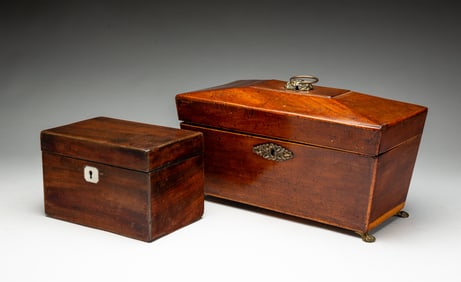 TWO ENGLISH MAHOGANY TEA CADDIES, INCL. SARCOPHAGUS-FORM EXAMPLE.