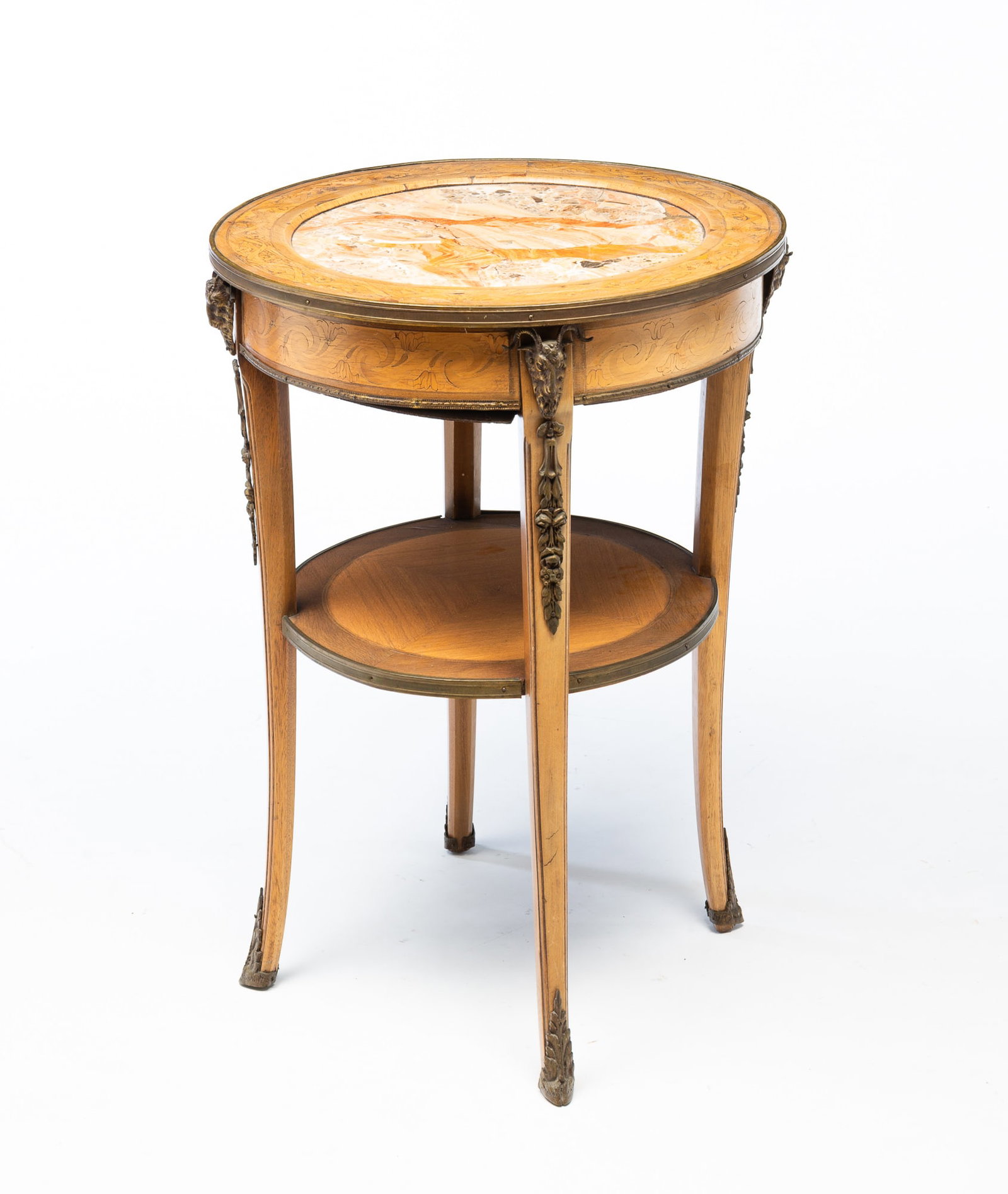 EMPIRE STYLE GILT METAL-MOUNTED MAHOGANY, MARQUETRY, AND MARBLE TOP GUÉRIDON.: European, Early 20th Century. Mahogany. Marquetry top ring and apron, insert marble to top, secondary shelf, slender tapered splayed legs and ormolu accents throughout. 30.5"h. 21.25"d.