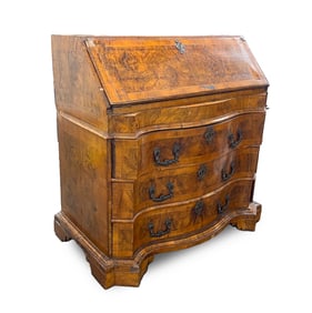 NORTH EUROPEAN BURR WALNUT AND CROSSBANDED SERPENTINE-FRONT BUREAU.
