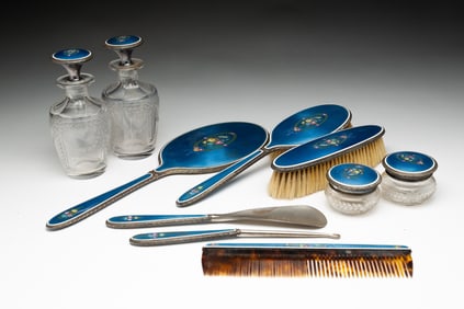 TEN-PIECE SILVERPLATE AND GUILLOCHE ENAMEL DRESSER SET.