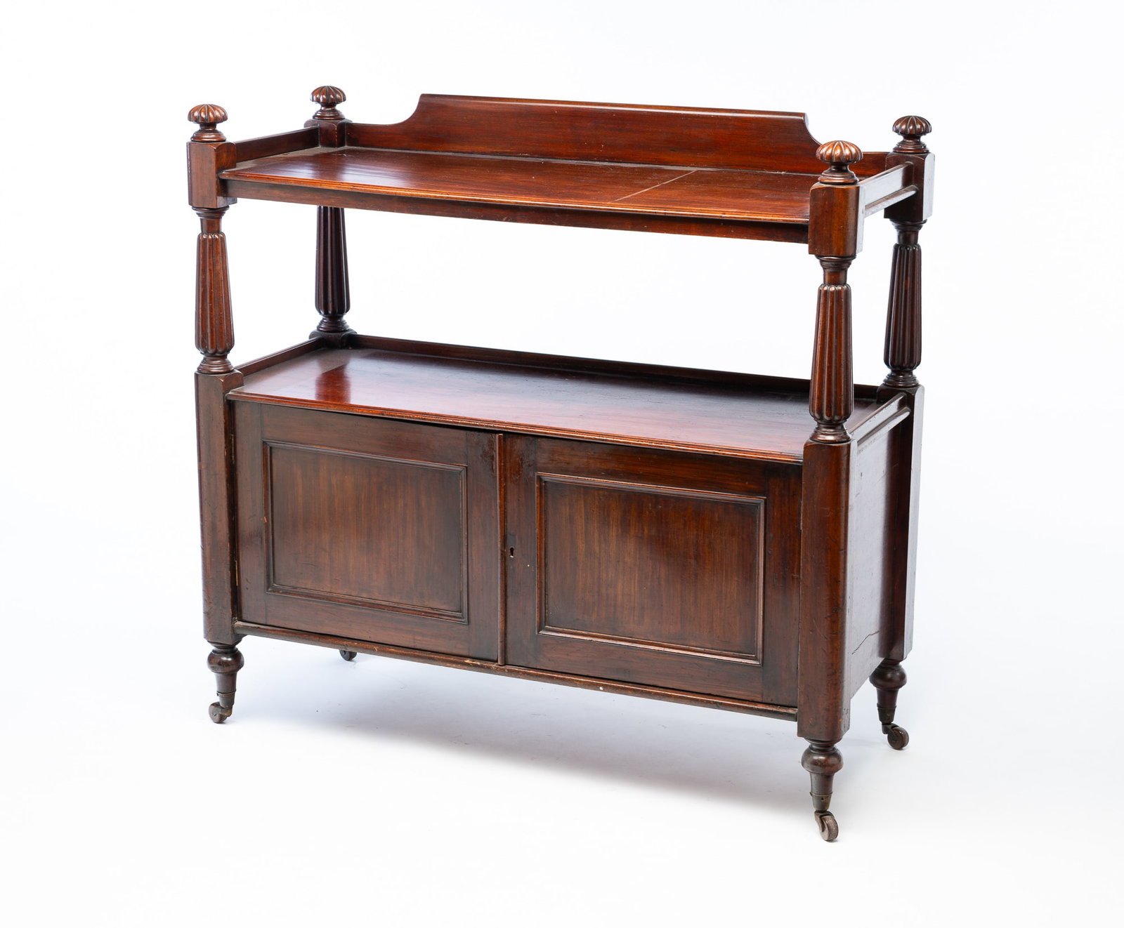 ENGLISH MAHOGANY DINING ROOM SIDE BOARD.: English, 19th Century. Mahogany. Tiered rectangular side board with scrolled backsplash, two shelves with continuous galleries and two doors to bottom that open to interior shelf. With fluted legs on 