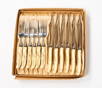TWELVE-PIECE LANDERS, FRARY & CLARK CELLULOID AND STAINLESS STEEL KNIFE AND FORK SET.