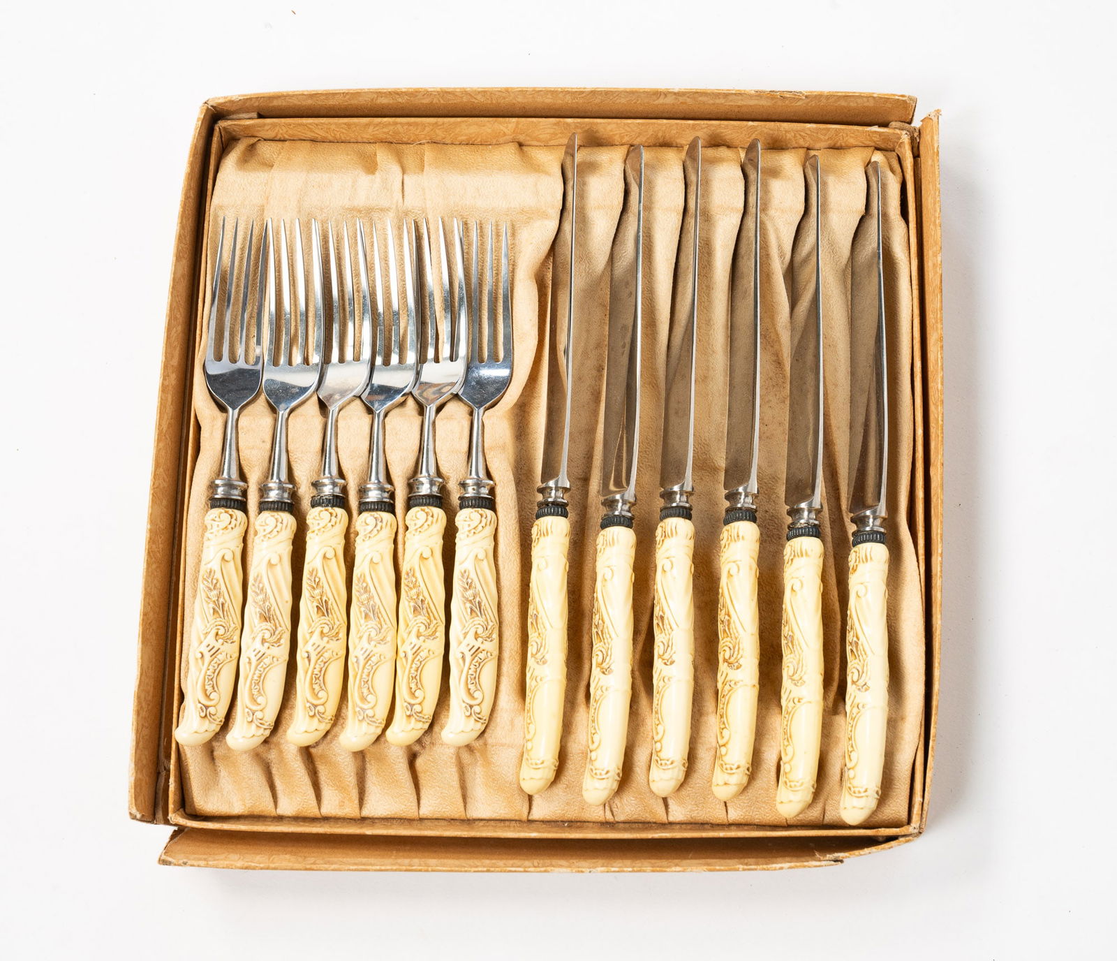 TWELVE-PIECE LANDERS, FRARY & CLARK CELLULOID AND STAINLESS STEEL KNIFE AND FORK SET. (1 of 3)