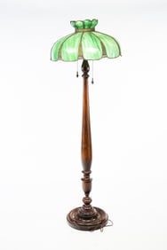 FLOOR LAMP WITH PANELED GREEN SLAG GLASS SHADE.