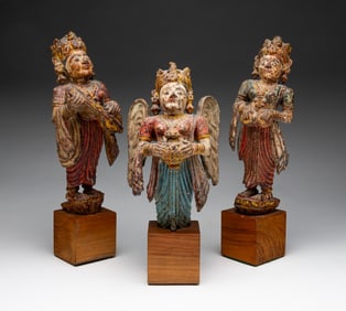 THREE SOUTHEAST ASIAN CARVED AND PAINTED WOODEN RELIGIOUS FIGURES ON STANDS.