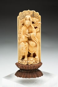 CARVED BUDDHA RIDING A FOO DOG.