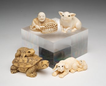 FOUR CARVED JAPANESE NETSUKE.
