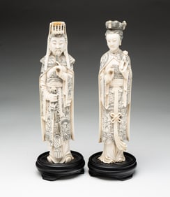 PAIR OF CHINESE CARVED AND INCISED FIGURES OF AN EMPEROR AND EMPRESS.