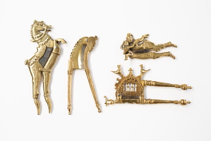 FOUR INDIAN BRASS FIGURAL BETEL NUT CUTTERS.