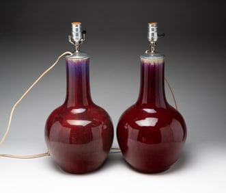 PAIR OF CHINESE SANG DE BOEUF GLAZED PORCELAIN VASE LAMPS.