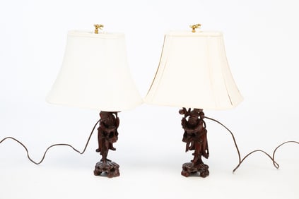 A PAIR OF CARVED CHINESE LAMPS.